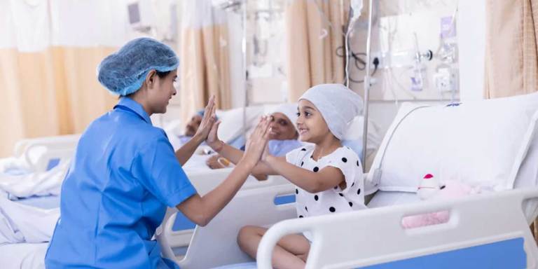 A doctor holding the hands with a young patient
