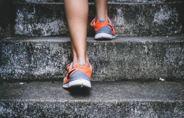 woman running up stairs