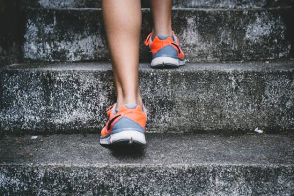 woman running up stairs