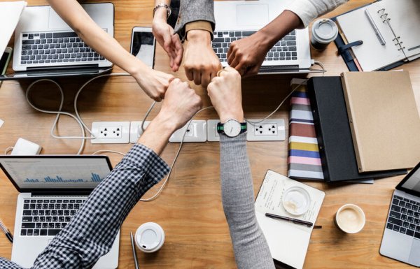 Colleagues giving a fist bump