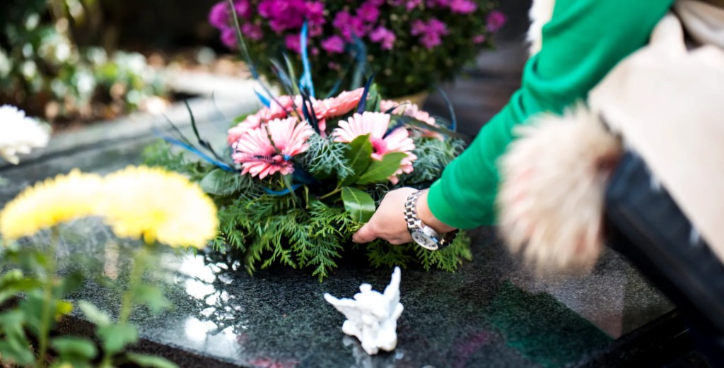 Laying a wreath on a coffin