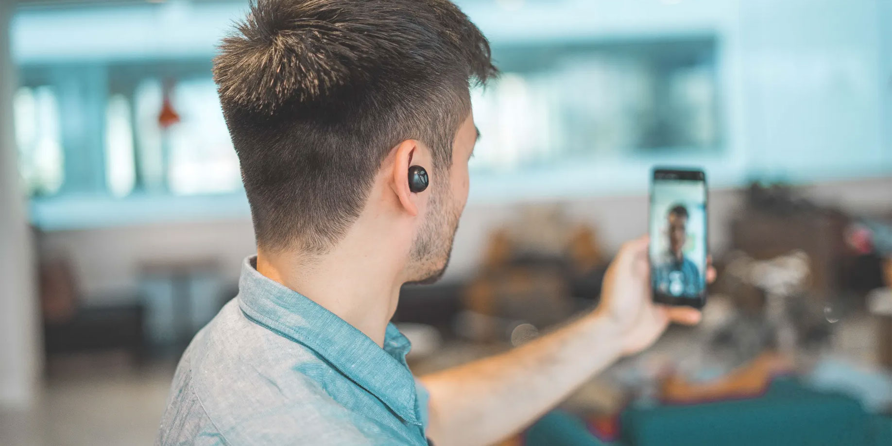 Person filming a video using a cellphone