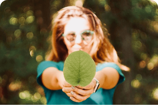 A person holding a leaf