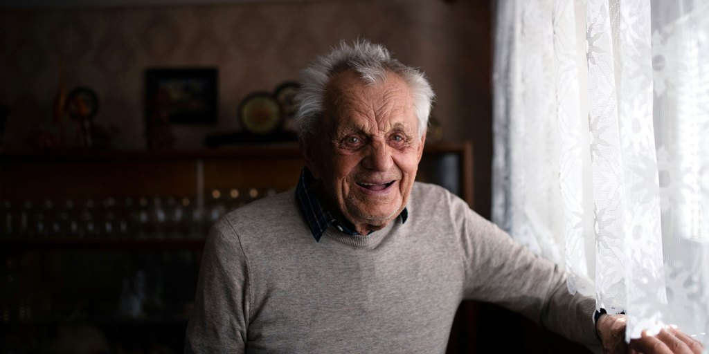 An elderly man smiling