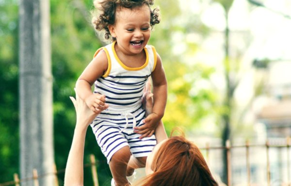 Parent playing with her child
