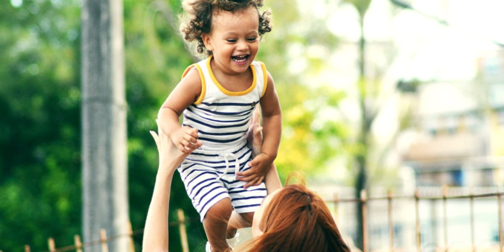 Parent playing with her child
