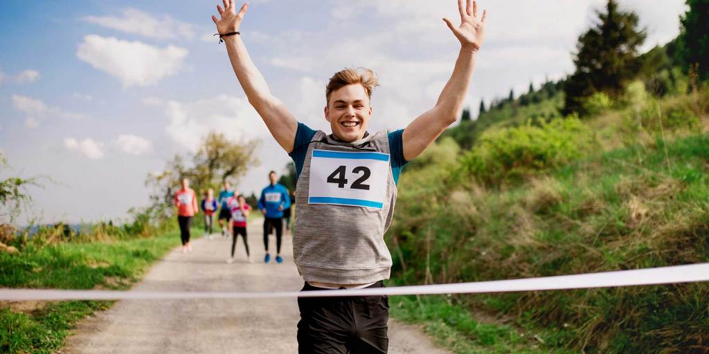 A person at the finish line of a 10k