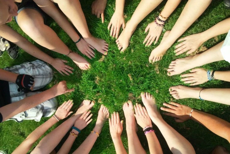 hands in grass