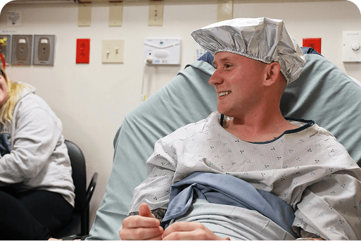 A smiling patient prepped for surgery