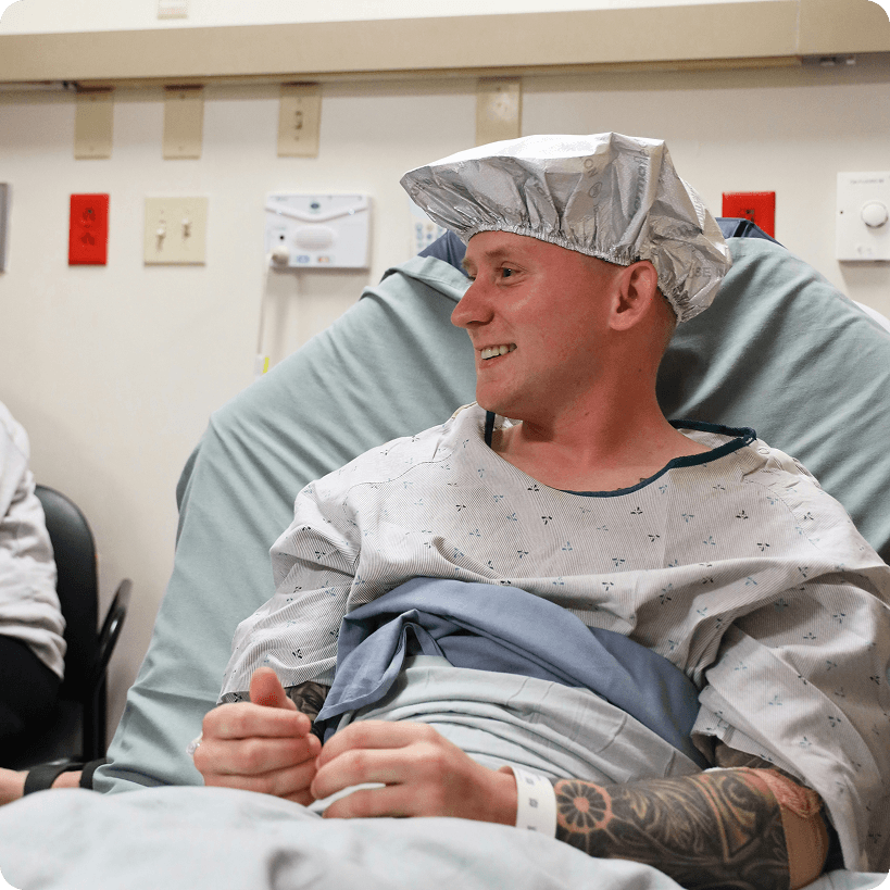 A smiling patient prepped for surgery