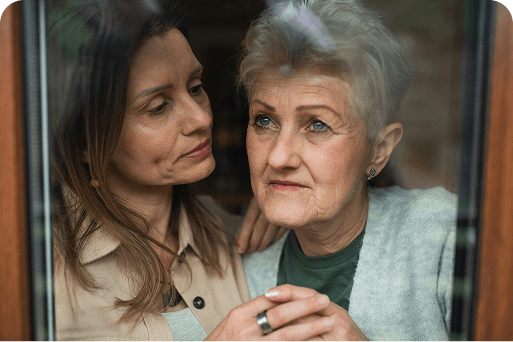A daughter consoling her mother