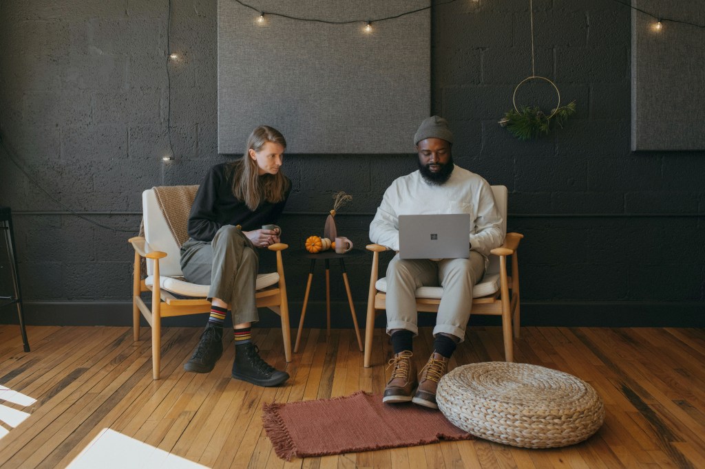 Couple working on a laptop surface