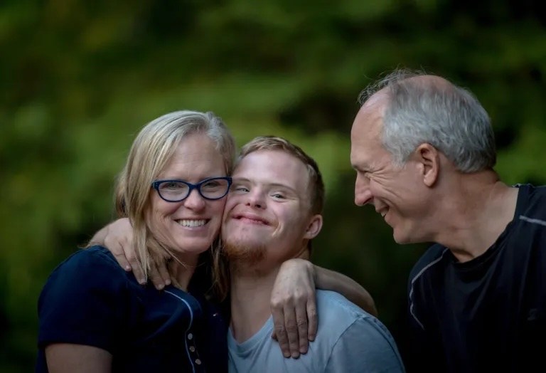 a family hugging one another