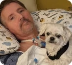 patient with tracheostomy and a small dog